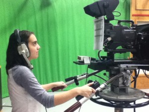 I (Lauren Aguirre) am operating a studio camera.  Throughout the semester, I have crewed for SMU's student news broadcast, The Daily Update.